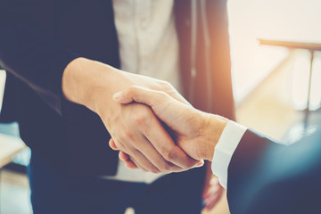 Business people colleagues shaking hands meeting Planning Strategy Analysis Concept