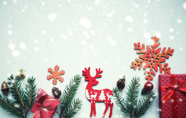 Fototapeta na wymiar Christmas and New Year card / spruce twigs,blank and figures of deers, snowflakes,