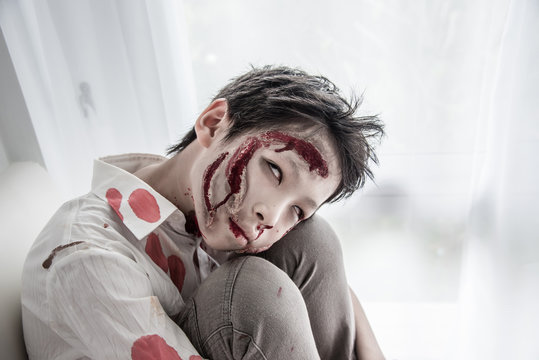 Young Asian boy in zombie make up for Halloween