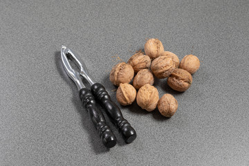 Classic cracker beside some walnuts on a tabkle