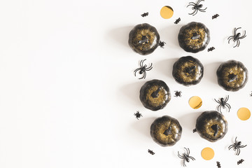 Halloween decorations, black pumpkins on white background. Halloween concept. Flat lay, top view, copy space