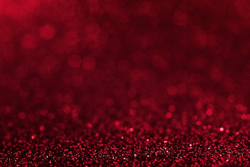 Shiny red abstract christmas background. Red glitter.