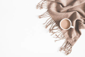 Autumn composition. Cup of coffee, plaid on white background. Autumn, fall concept. Flat lay, top view, copy space