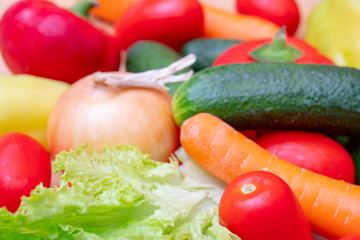 Vegetables: lettuce, onions, tomatoes, cucumbers, onions, carrots, red sweet peppers.