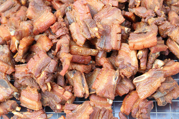 Fried pork spare-ribs  on stainless tray ready for sale in the market.