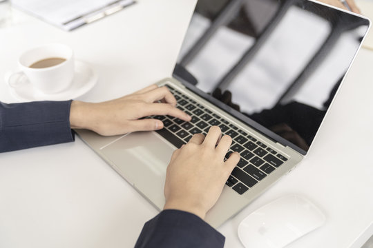 secretary woman typist or working with tablet in office