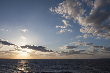 Naklejka na ściany i meble Ocean Sunset with Clouds