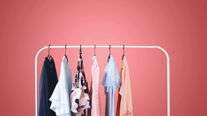 Women's clothing on a white clothes hanger on pink pastel background. - Powered by Adobe