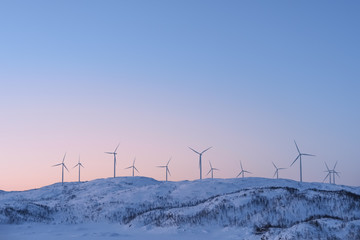 View at the wind turbines farm in Norway in winter.