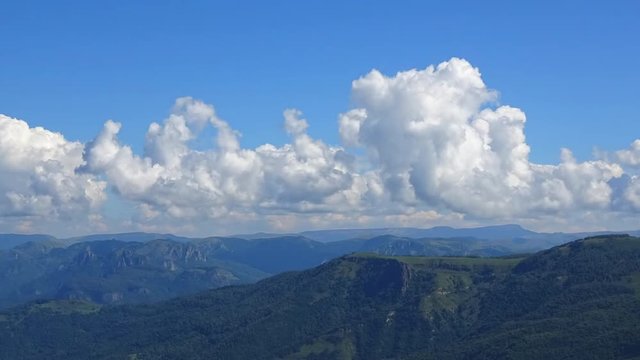 Time lapse mountains scenes in national park Dombai, Caucasus, Russia, Europe. Summer landscape, sunshine weather, blue sky and sunny day
