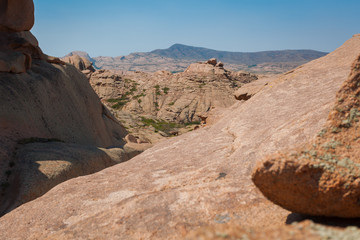 Fototapeta na wymiar View from rock to mountains on the horizon