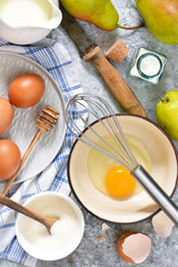 Ingredients for pie with pears. The process of making sweet pastries. Ingredients for baking.