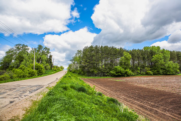Plowed field in south central Wisconsin and country road
