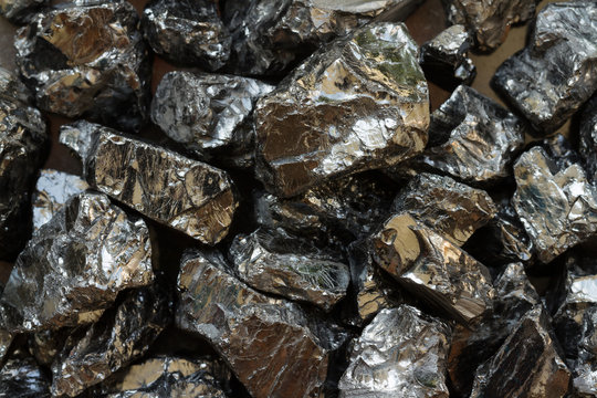 Natural black coal bars for background. Industrial coal nuggets close up