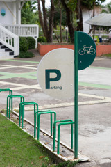 Public bike parking rack on pedestrian overpass.