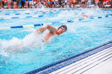 Freestyle swimmer in a race