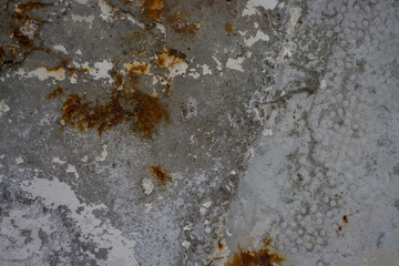 Old, rusty concrete wall with rust and cracks