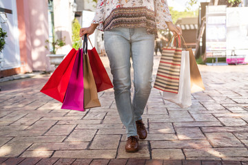 Young woman with shopping bags at shopping mall on black friday, Woman lifestyle concept