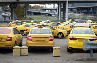 Cars from service Yandex Taxi wating for the order at the parcking