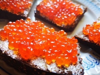 4 sandwiches with red caviar