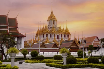 Foto op Canvas Loha Prasart at Wat Ratchanatda while beautiful sunset sky in Bangkok, Thailand. © newroadboy