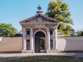 Fototapeta na wymiar The 18th century gatehouse of the Rossendael Abbey in Walem, near Mechelen, Belgium. Currently it is a public recreation park.