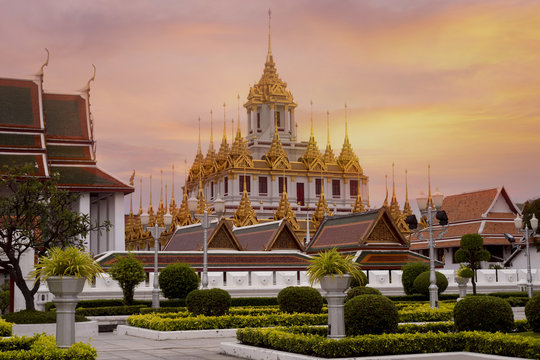 Loha Prasart at Wat Ratchanatda while beautiful sunset sky in Bangkok, Thailand.