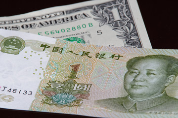 One chinese yuan banknote is above one american dollar