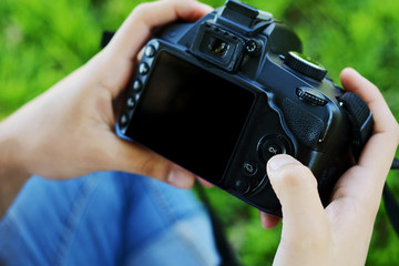 Professional woman looking at photo camera