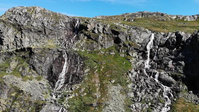 Waterfall in mountains. National tourist scenic route 55 Sognefjellet between Lom and Luster, Norway. Summertime