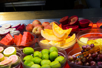 Tropical fruits in a fruit salad store