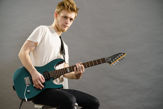 Man playing on electric guitar