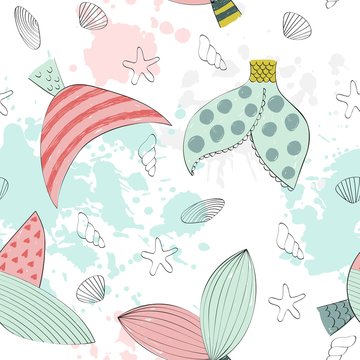 Vector seamless pattern with a mermaids tail and seashells
