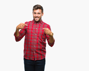 Young handsome man over isolated background looking confident with smile on face, pointing oneself with fingers proud and happy.