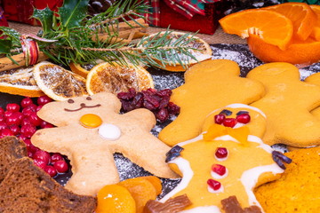Festive Gingerbread Characters.  Selection of festive decorated Christmas Gingerbread characters surrounded by presents and gifts.