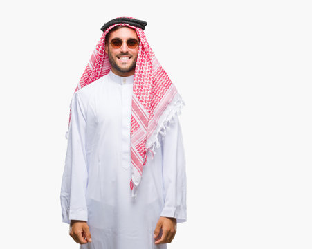 Young handsome man wearing keffiyeh over isolated background with a happy and cool smile on face. Lucky person.