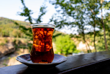 Turkish tea green bokeh background. turkish tea on wooden table
