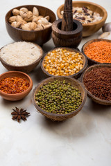 cereals, seeds, beans, grains in a bowls on white table