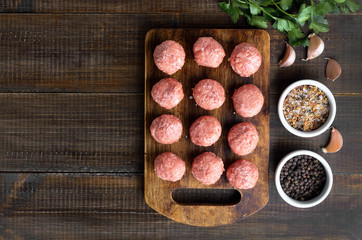 Raw meatballs and spices