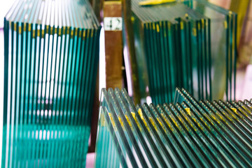 Sheets of Factory manufacturing tempered clear float glass panels cut to size - obrazy, fototapety, plakaty