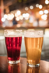 cold beer glass on bar or pub desk with bokeh Business People Party Celebration Success Concept
