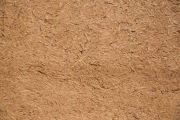 Detail of a wall made of dirt bricks.