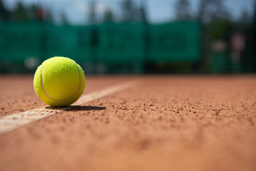 Close-up focus of sport outfit while it is lying on sunny playground. It is being used by sports people during game set. Copy space in right side
