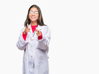 Young arab doctor woman over isolated background pointing fingers to camera with happy and funny face. Good energy and vibes.