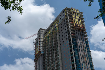 Lifting crane and high building under construction