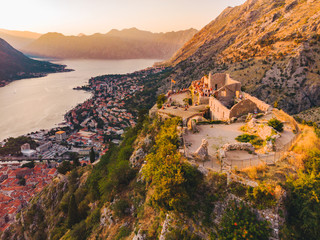 aerial view of kotor bay with kotor city on sunset