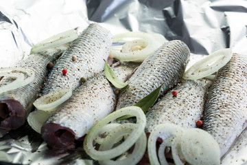 Fish, fresh mullet, cooking, bake in foil, close-up