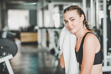 Fototapeta na wymiar woman rest in gym after workout