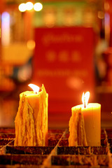 Large candle's burning at the temple