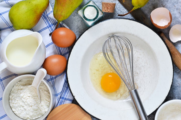 Ingredients for pie with pears. The process of making sweet pastries. Ingredients for baking.